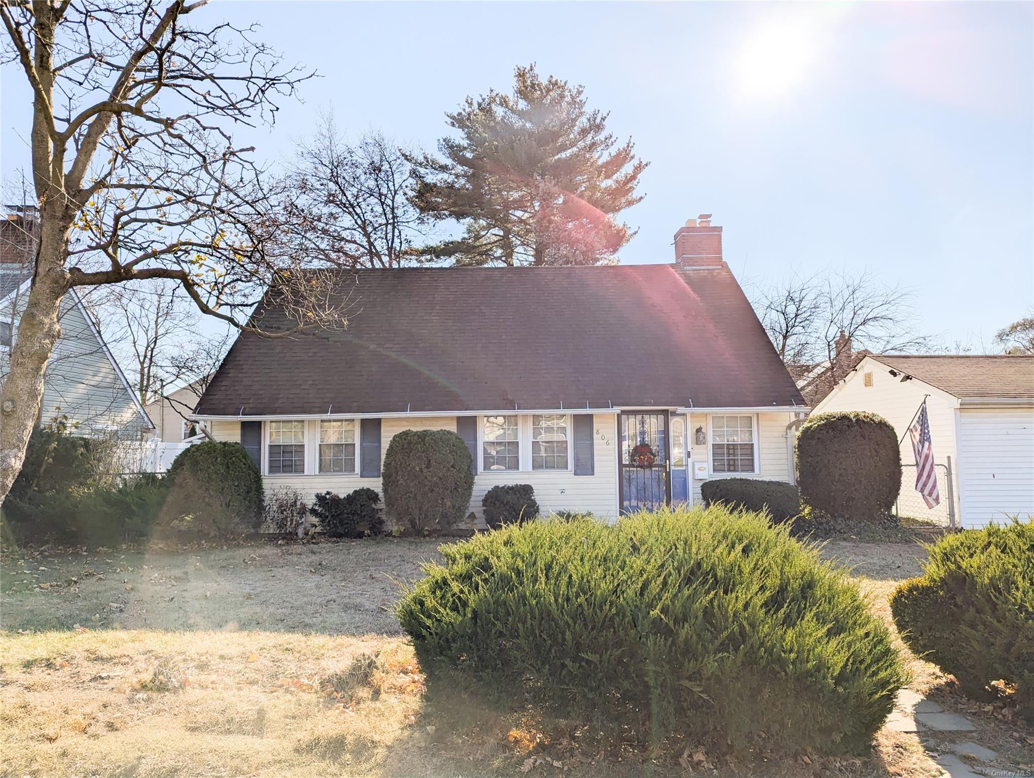 Cape cod home with a front yard