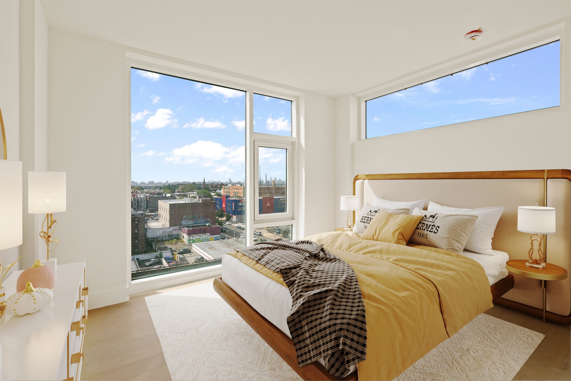 a bed sitting in a bedroom next to a large window