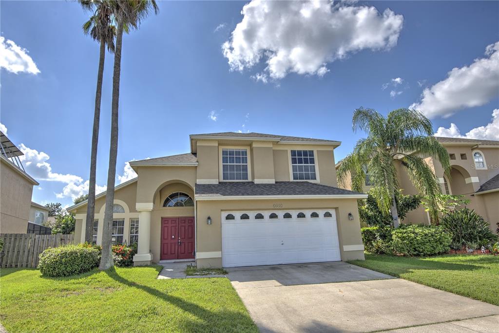 a front view of house with yard and entertaining space