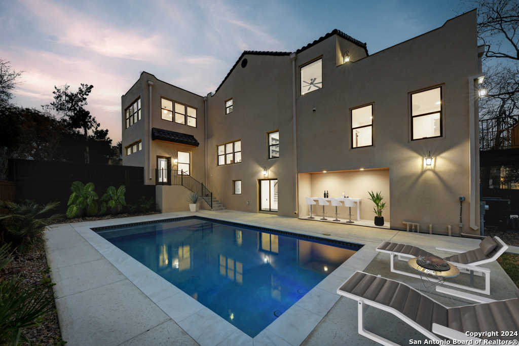 a view of a swimming pool with a patio