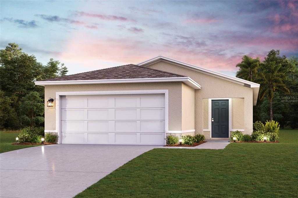 front view of a house with a yard and garage