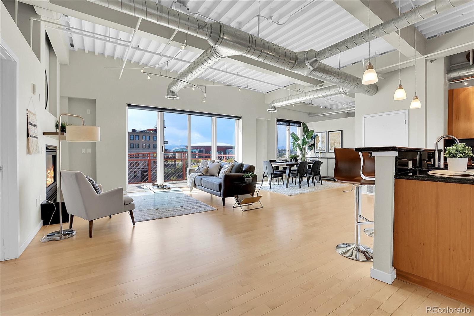 a lobby with furniture and a flat screen tv