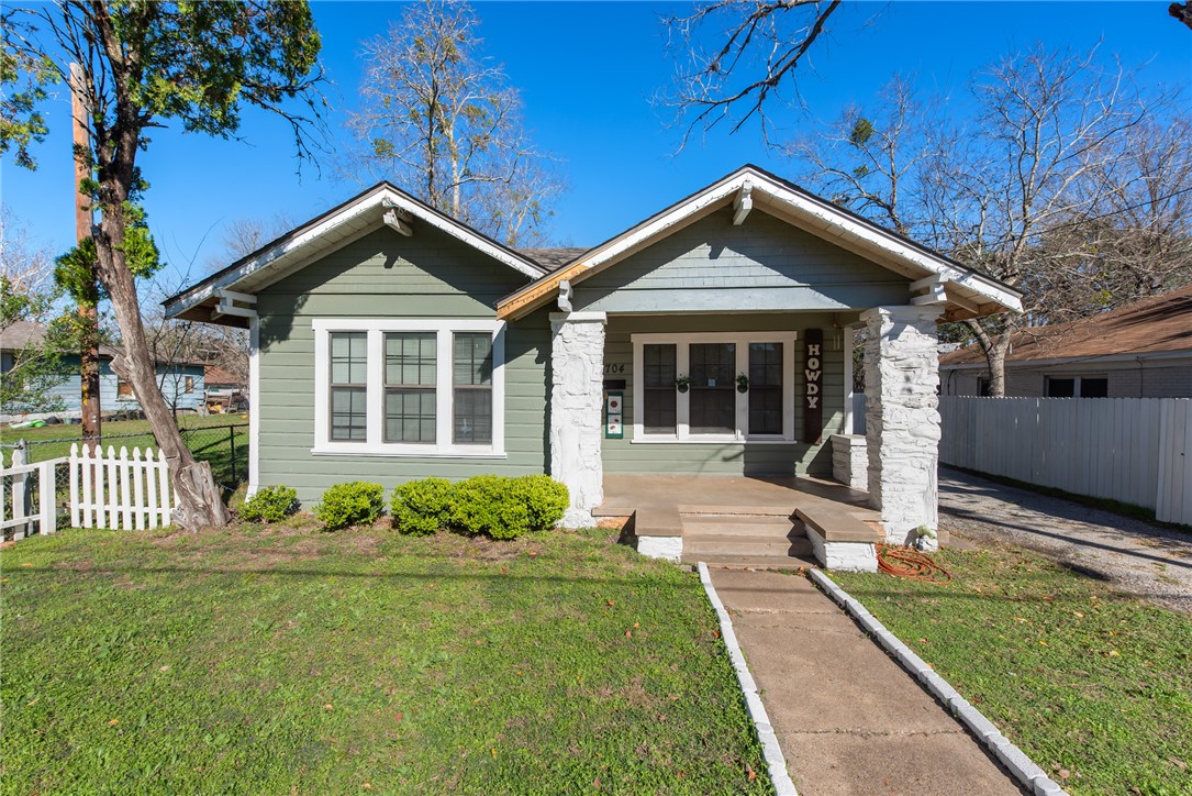 Bungalow-style home with covered porch and a front