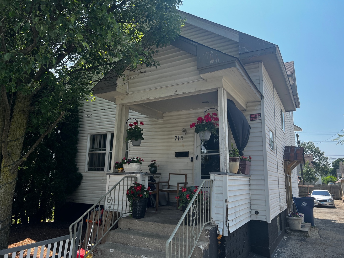 a view of house with deck and outdoor seating