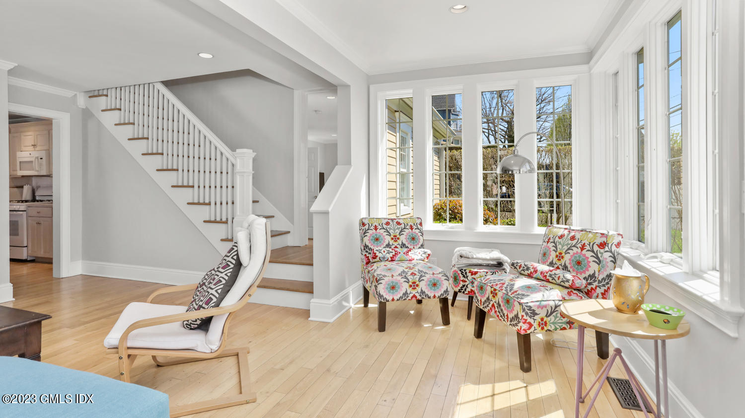 a view of a livingroom with furniture and stairs