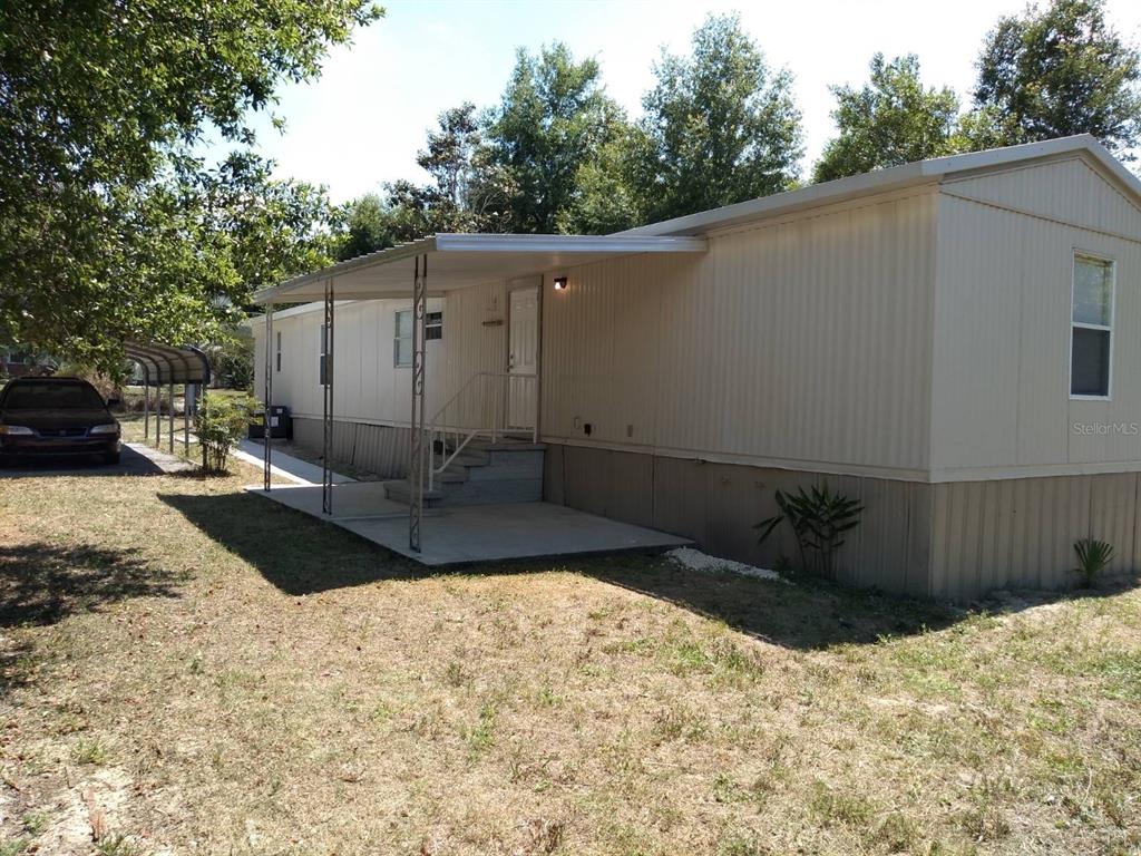 a view of a backyard of the house