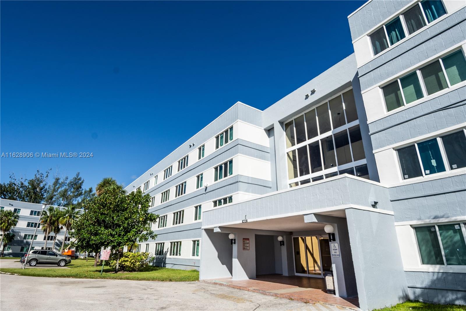 a view of a building with a yard