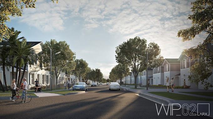 a city street lined with buildings and trees