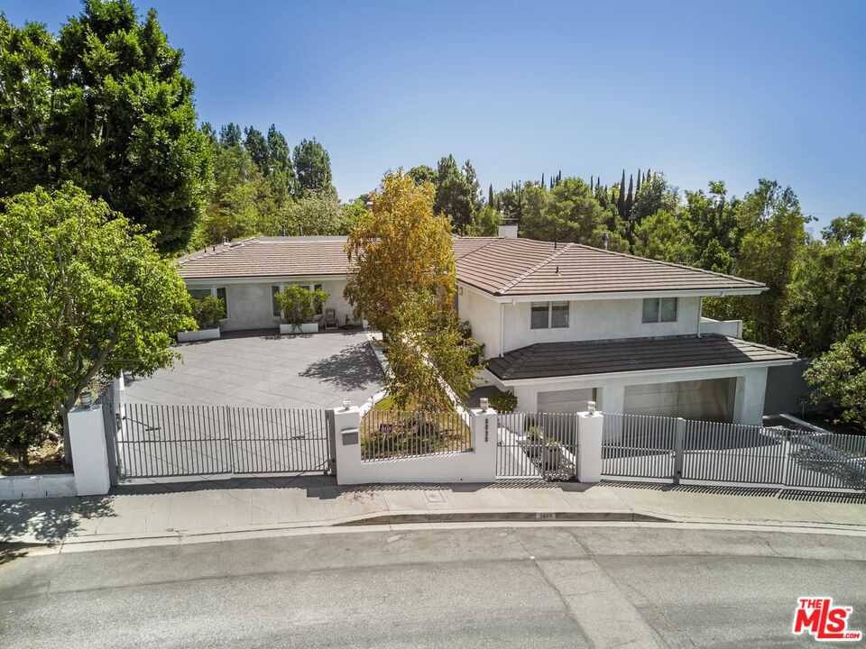 front view of a house with a small yard