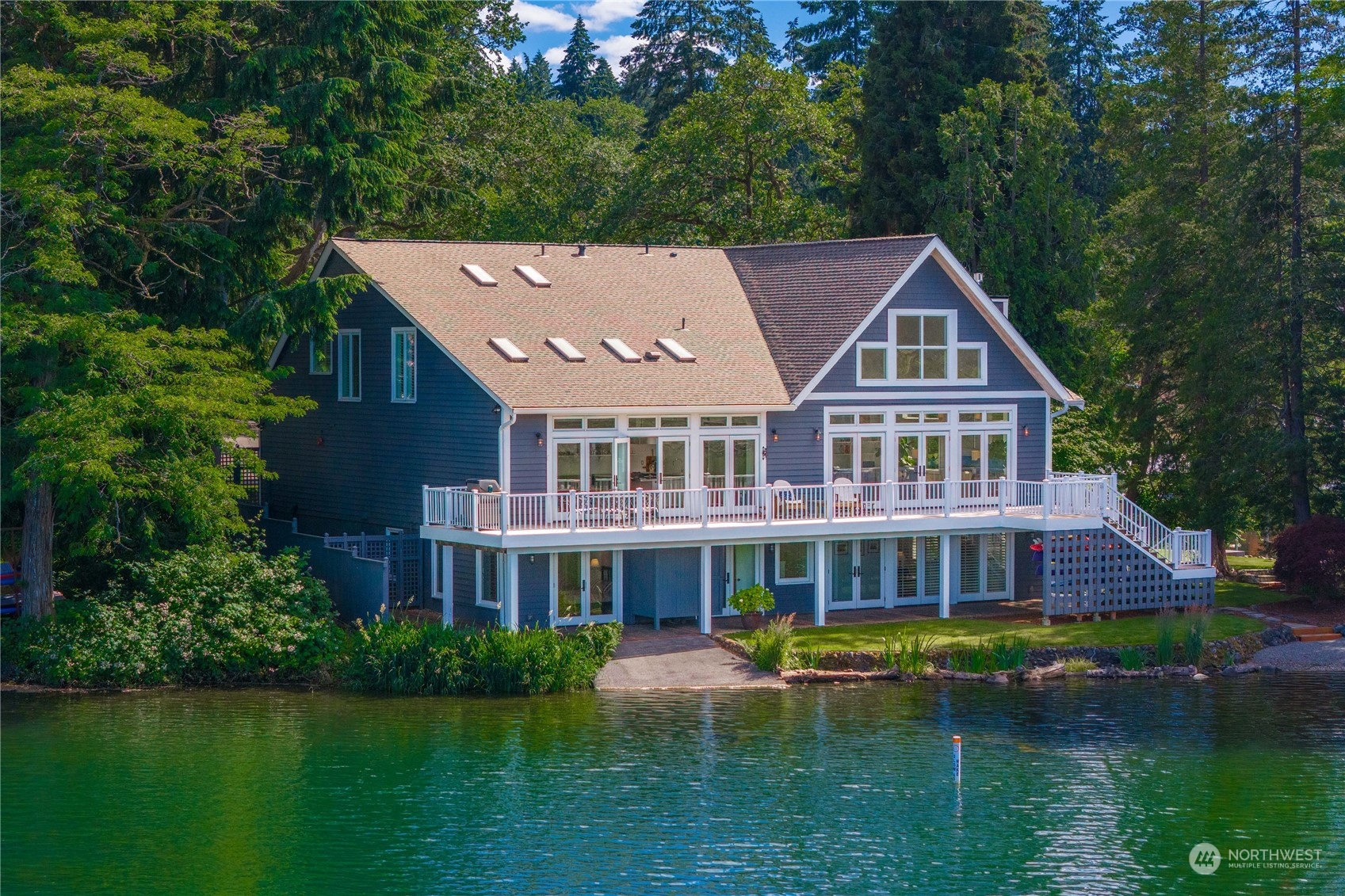 a aerial view of a house with a yard