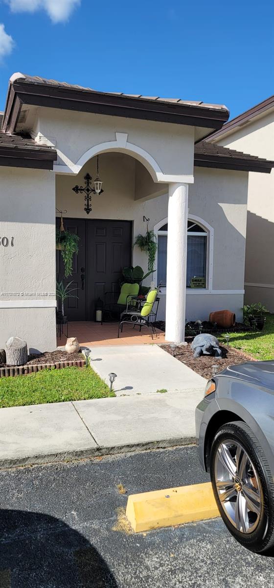 a car parked in front of a house