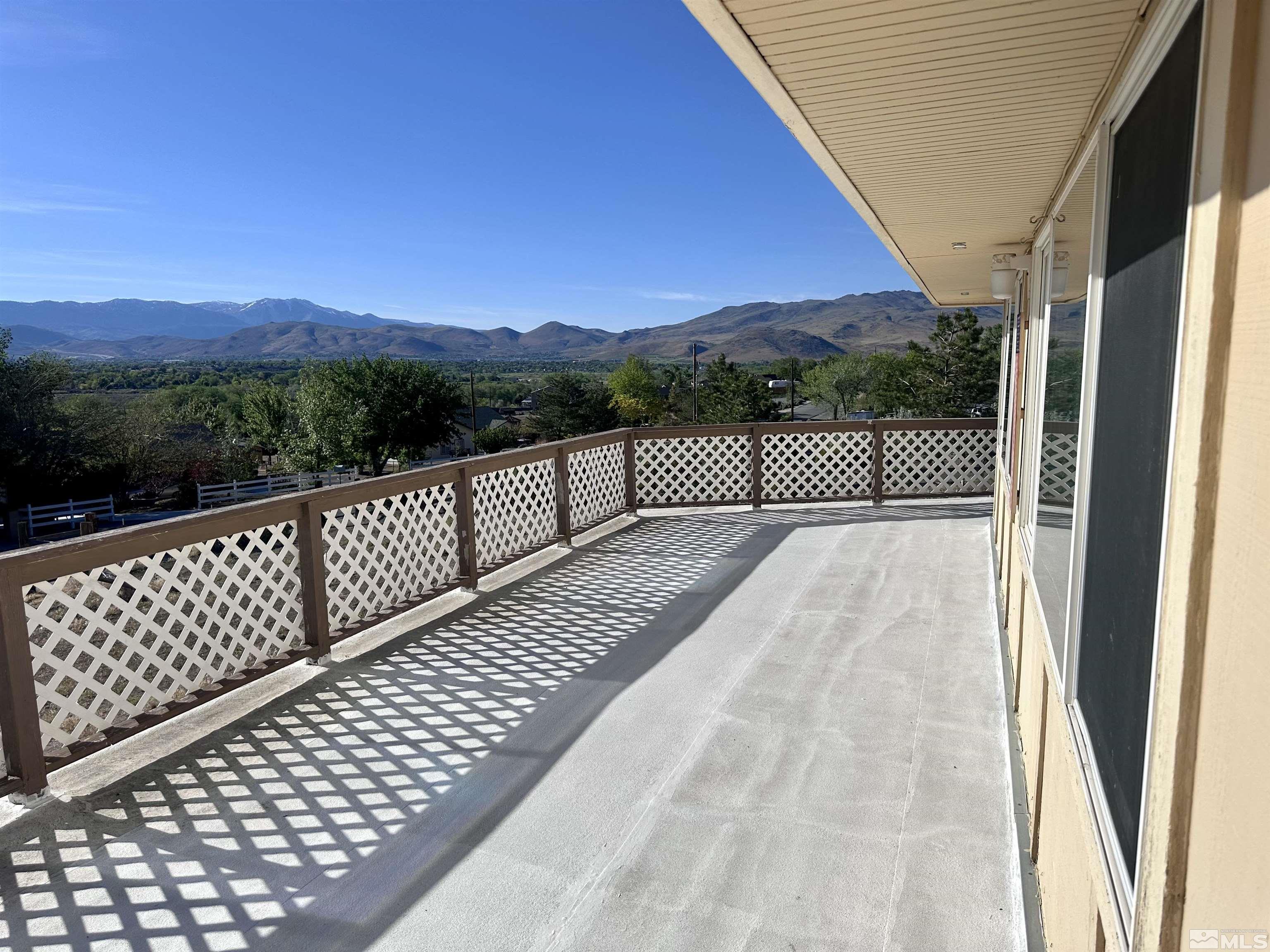 a view of balcony with a wooden fence