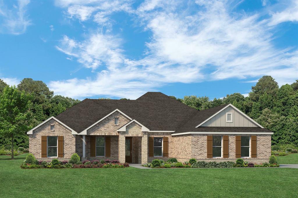 a view of a big house with a big yard and large trees