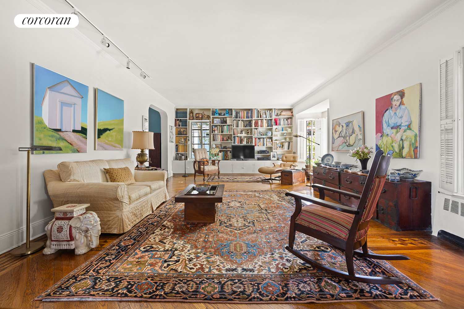 a living room with furniture and a rug