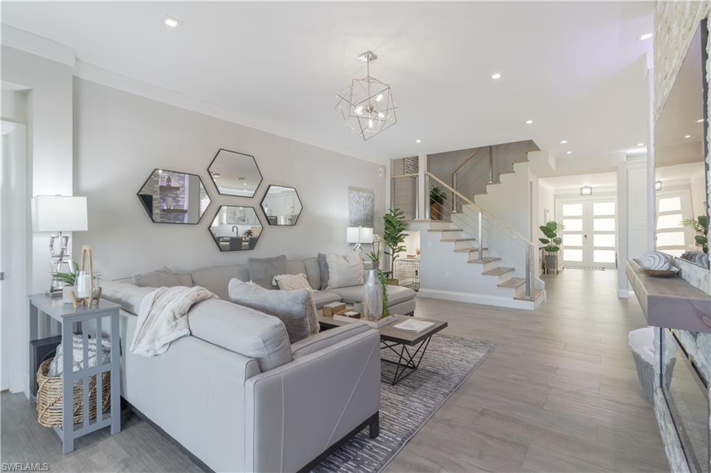 a living room with furniture and a table