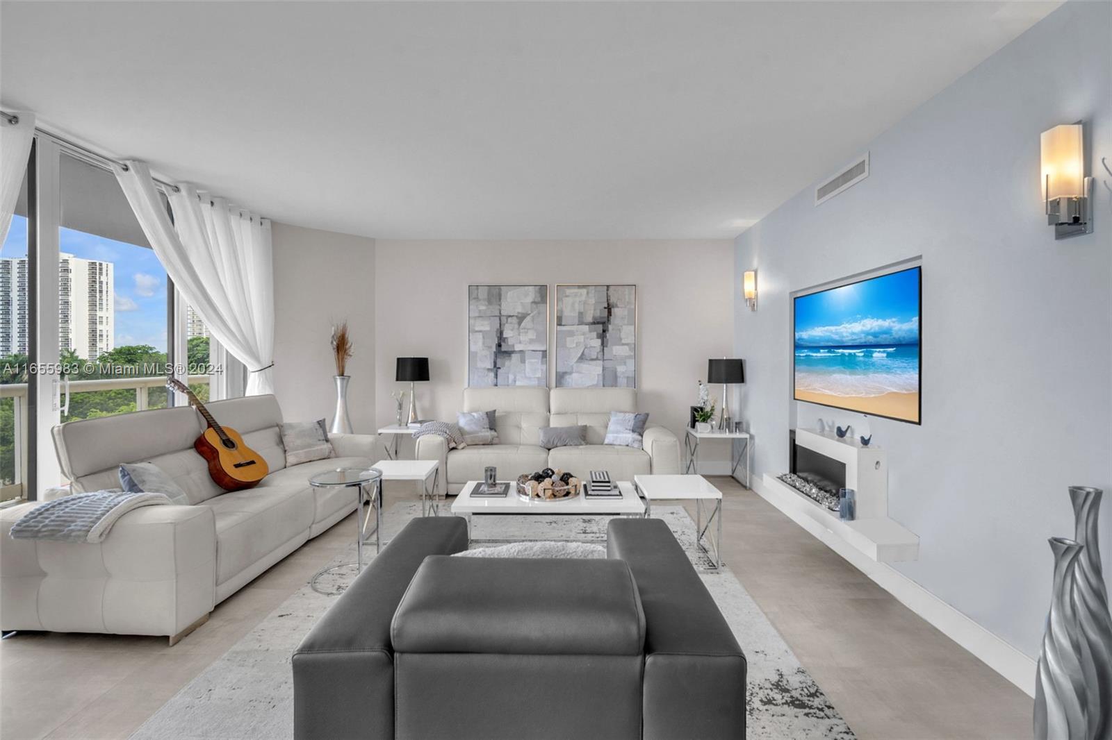 a living room with furniture and a flat screen tv