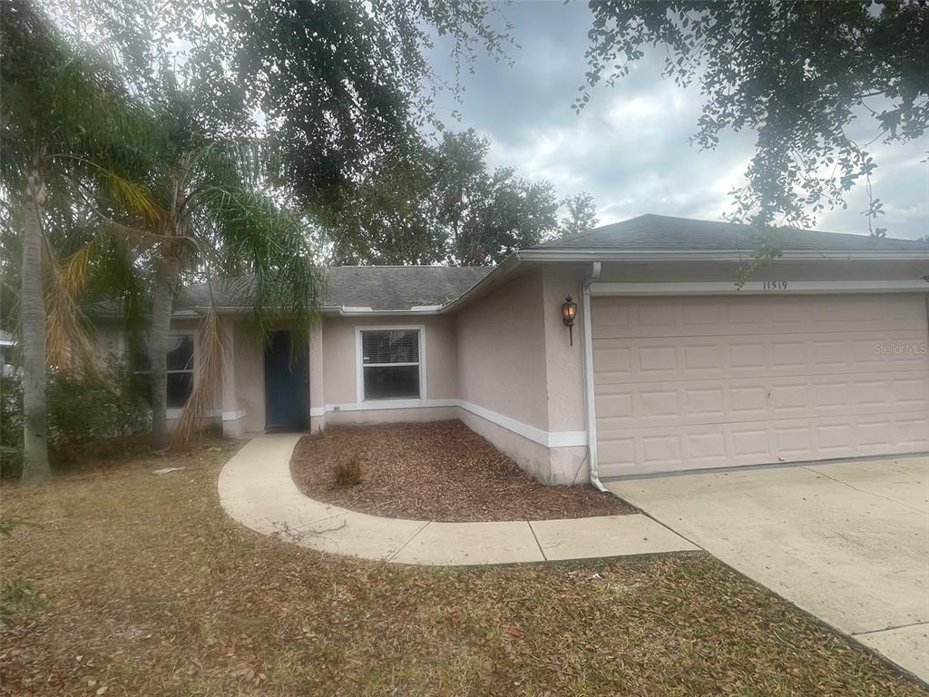 front view of a house with a yard