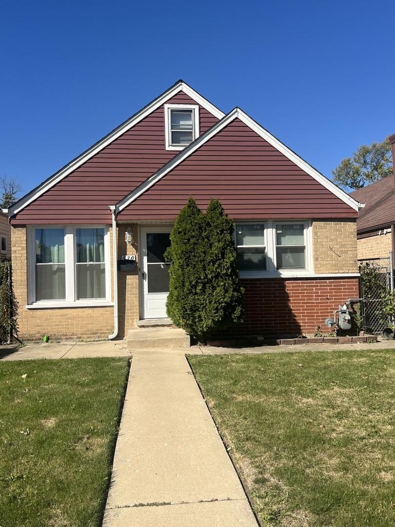 a front view of a house with yard