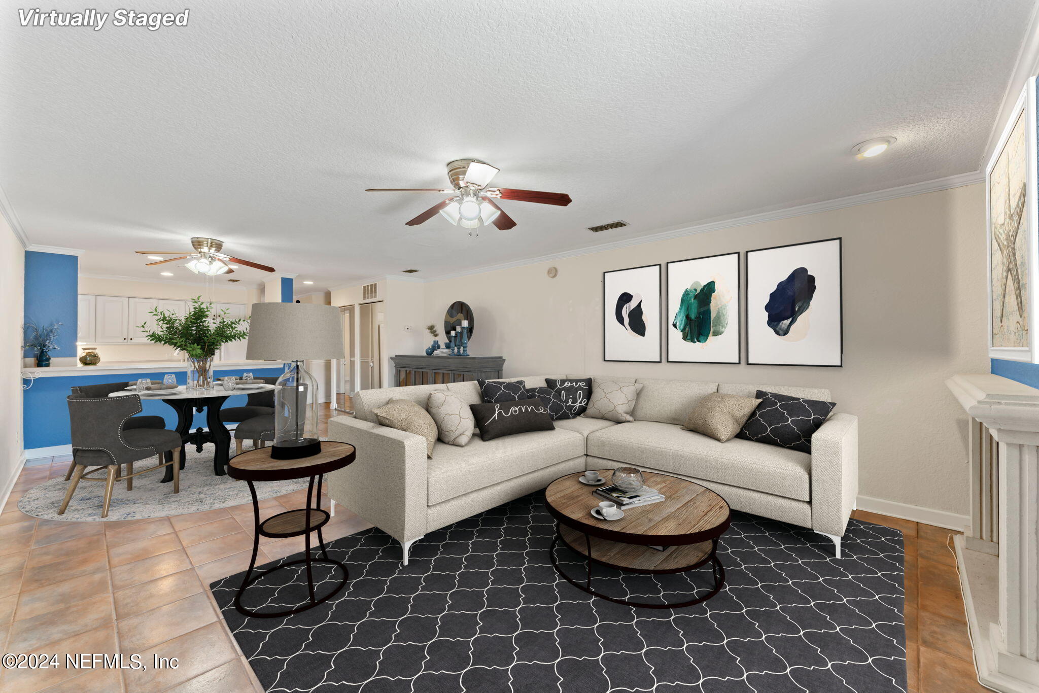 a living room with furniture a rug and a chandelier