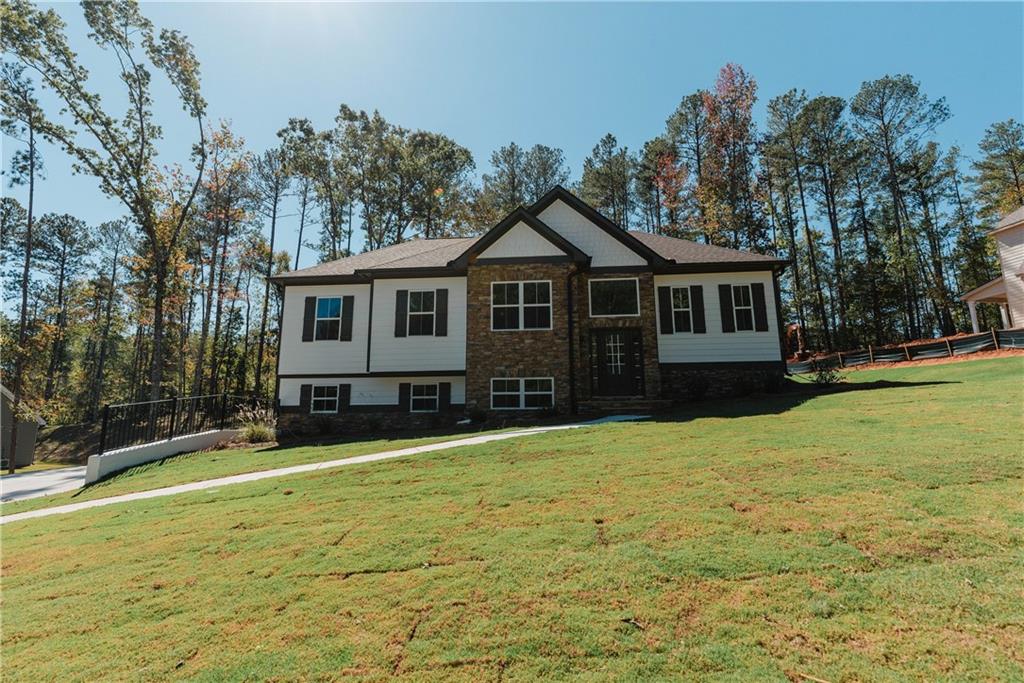 a front view of a house with a yard