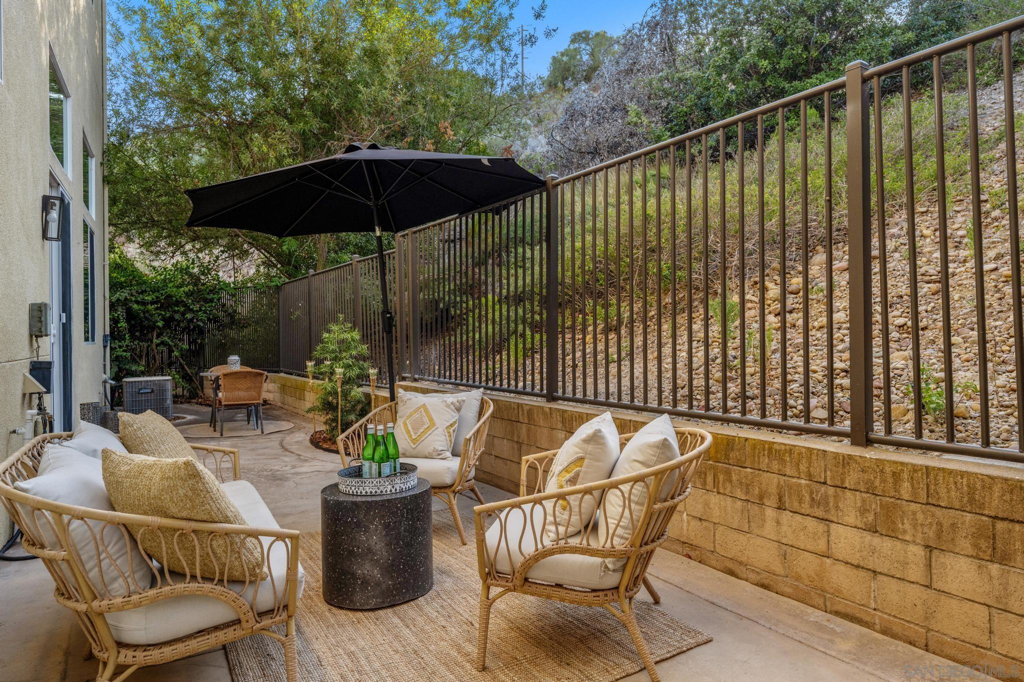 a patio with a patio table and chairs