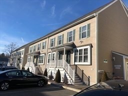 a front view of a house with parking space