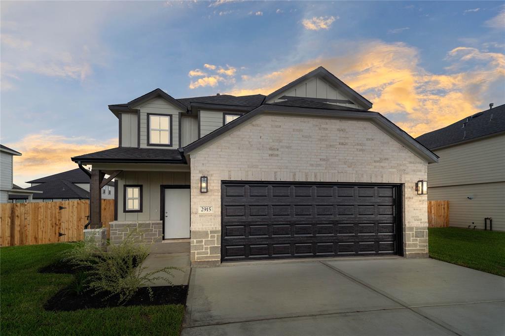 a front view of a house with garage