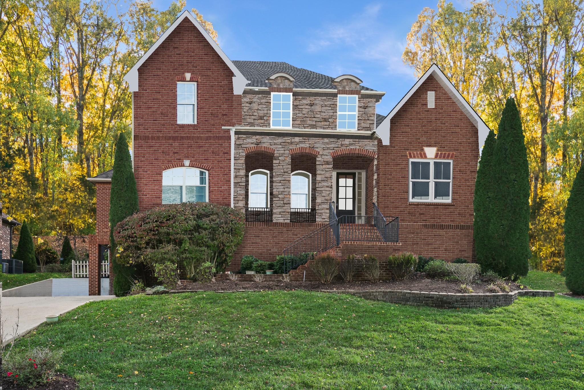 a front view of a house with a yard