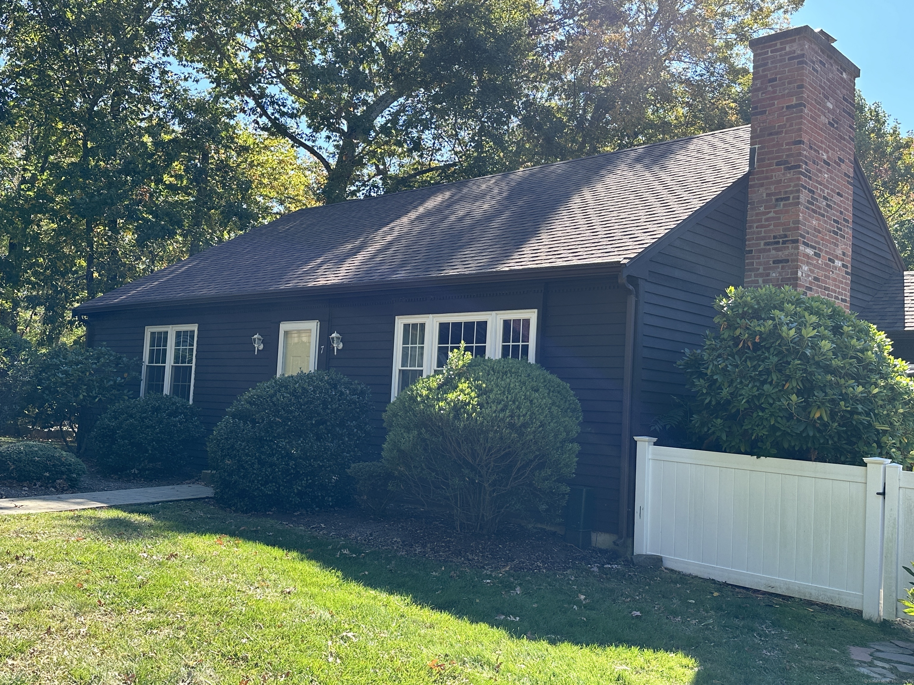 a view of a house with a yard and plants