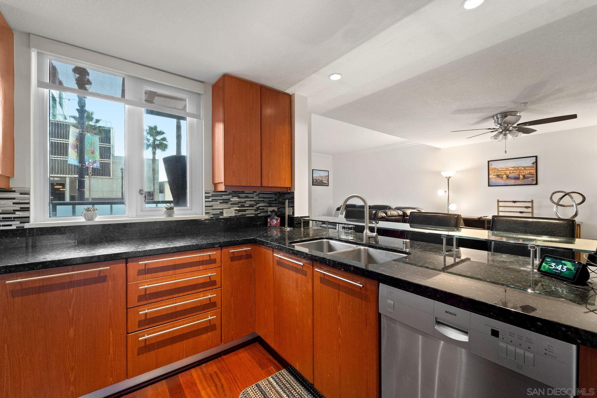 a kitchen with stainless steel appliances a sink and cabinets