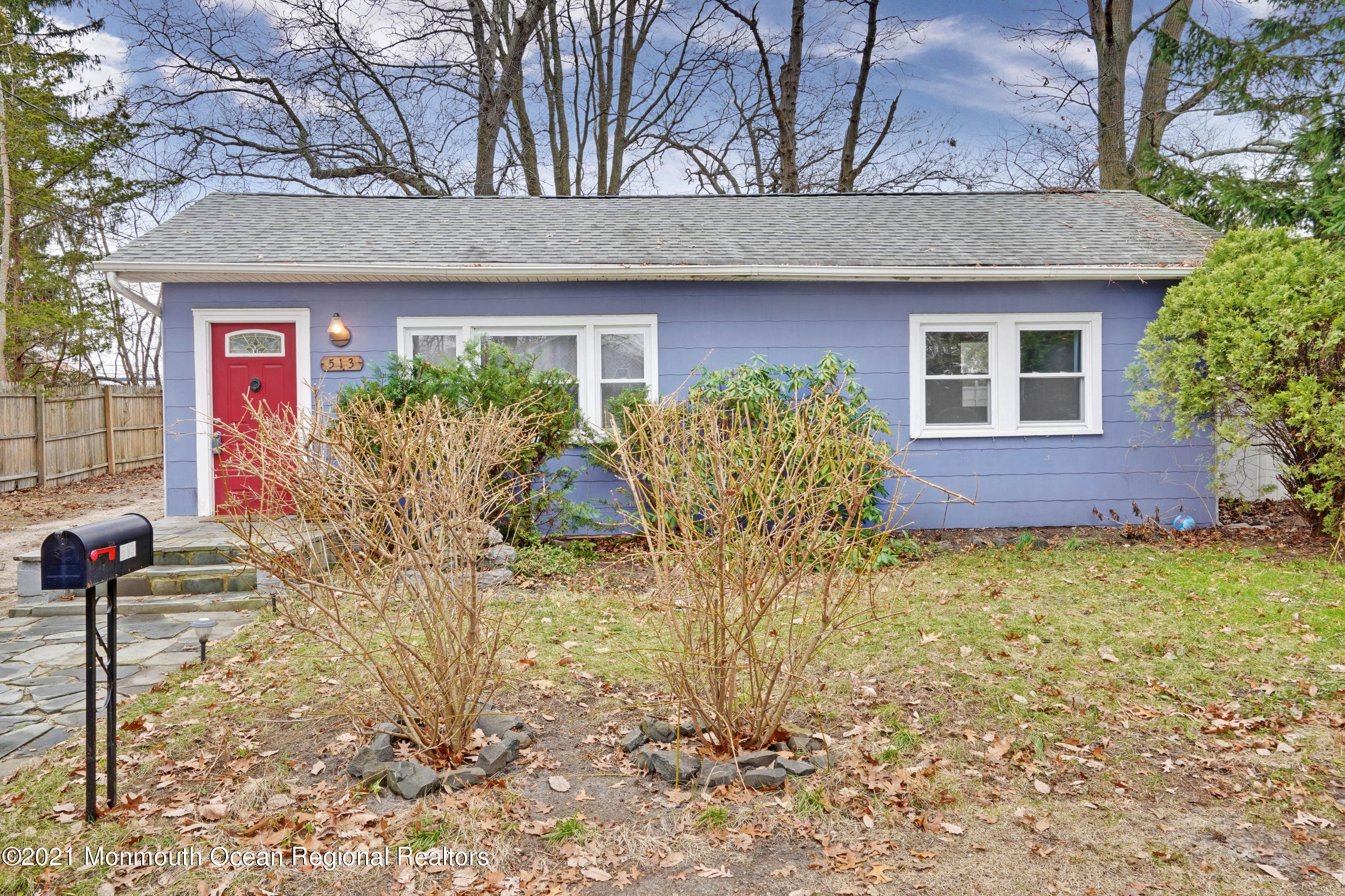 a view of a house with a yard and plants