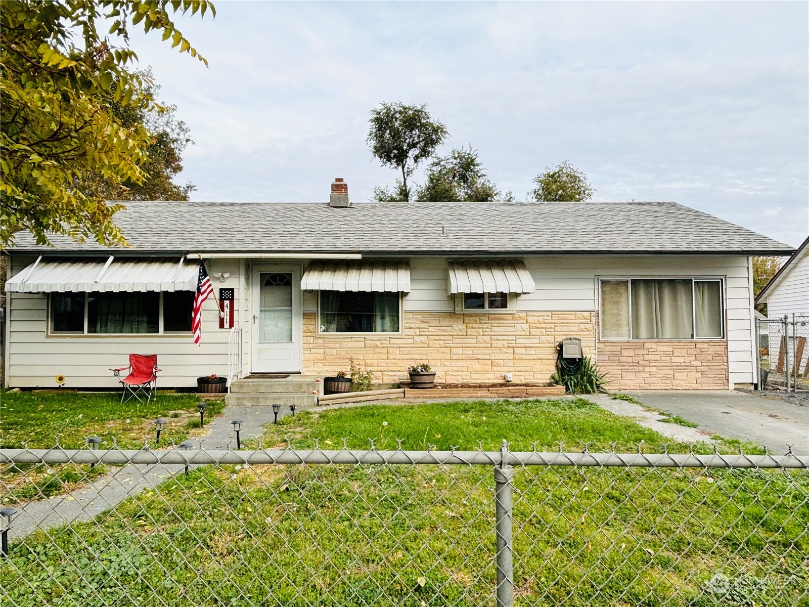 a front view of a house with a yard