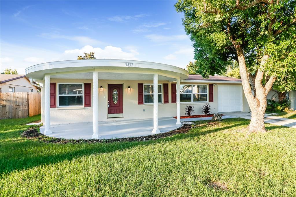 front view of a house with a yard