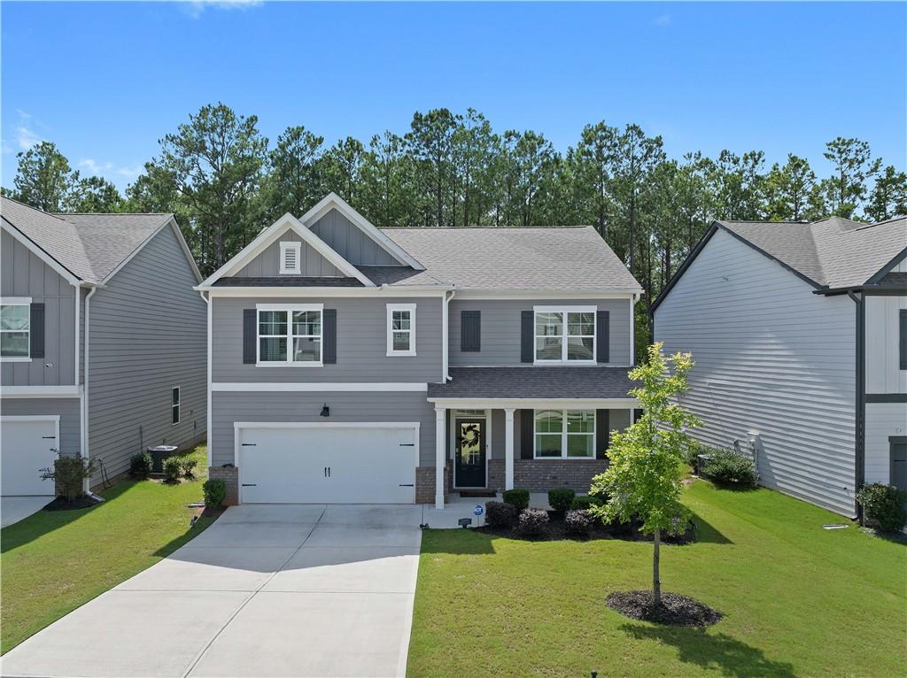 a front view of a house with a yard