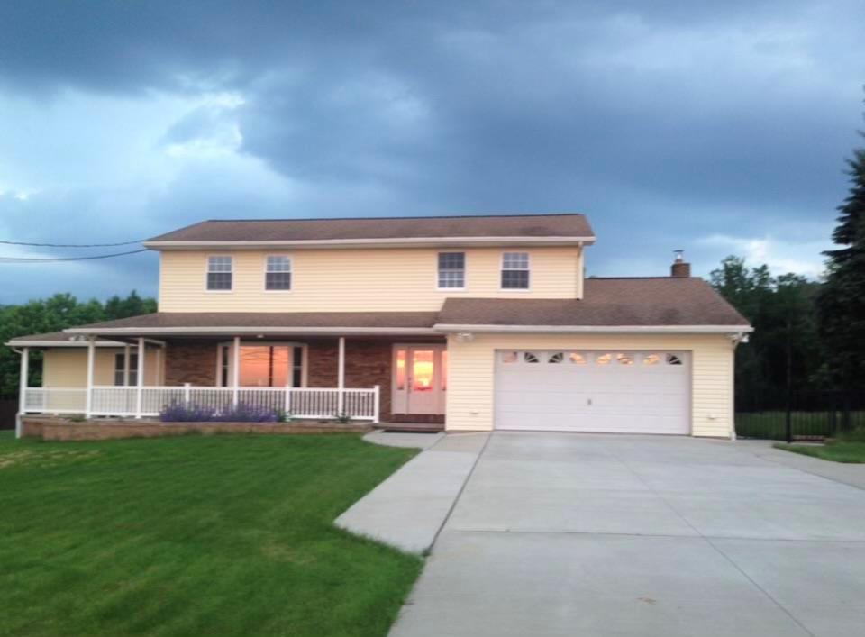 front view of house with a yard