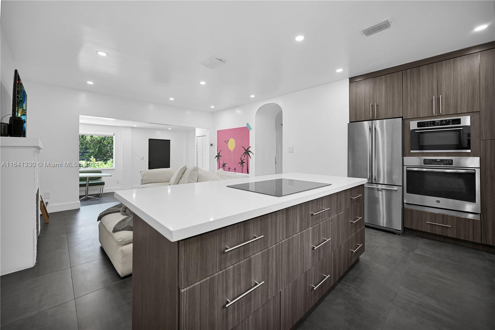 a kitchen with counter top space cabinets and stainless steel appliances