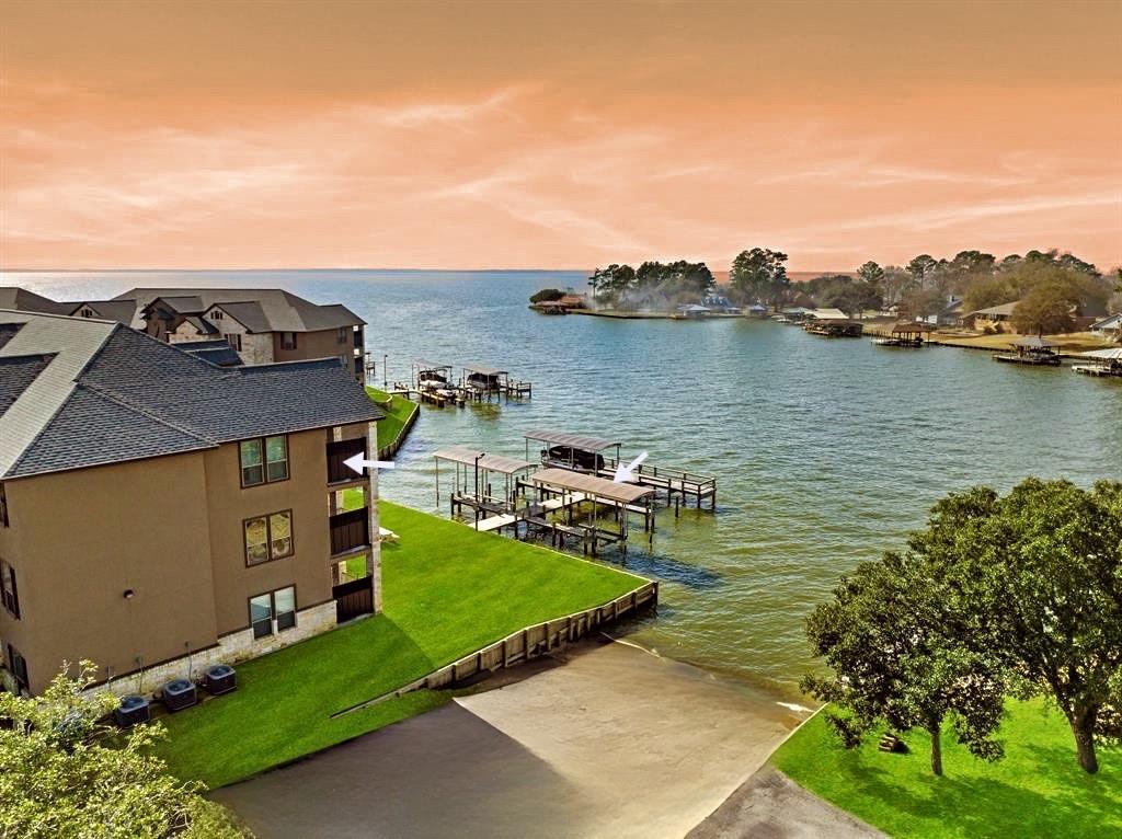 an aerial view of a house with a lake view