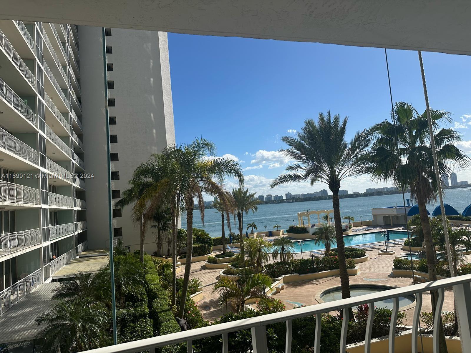 a view of balcony with palm trees