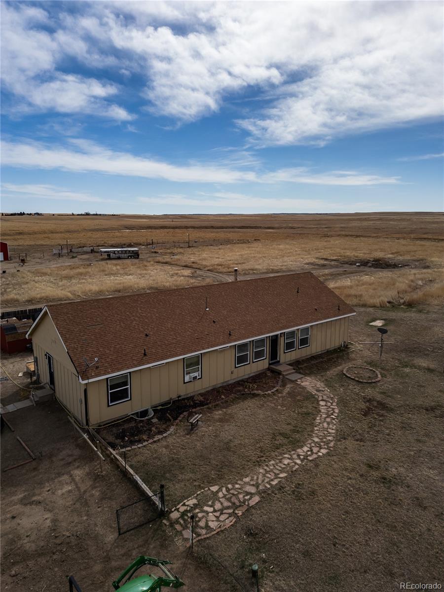 an aerial view of a building with beach