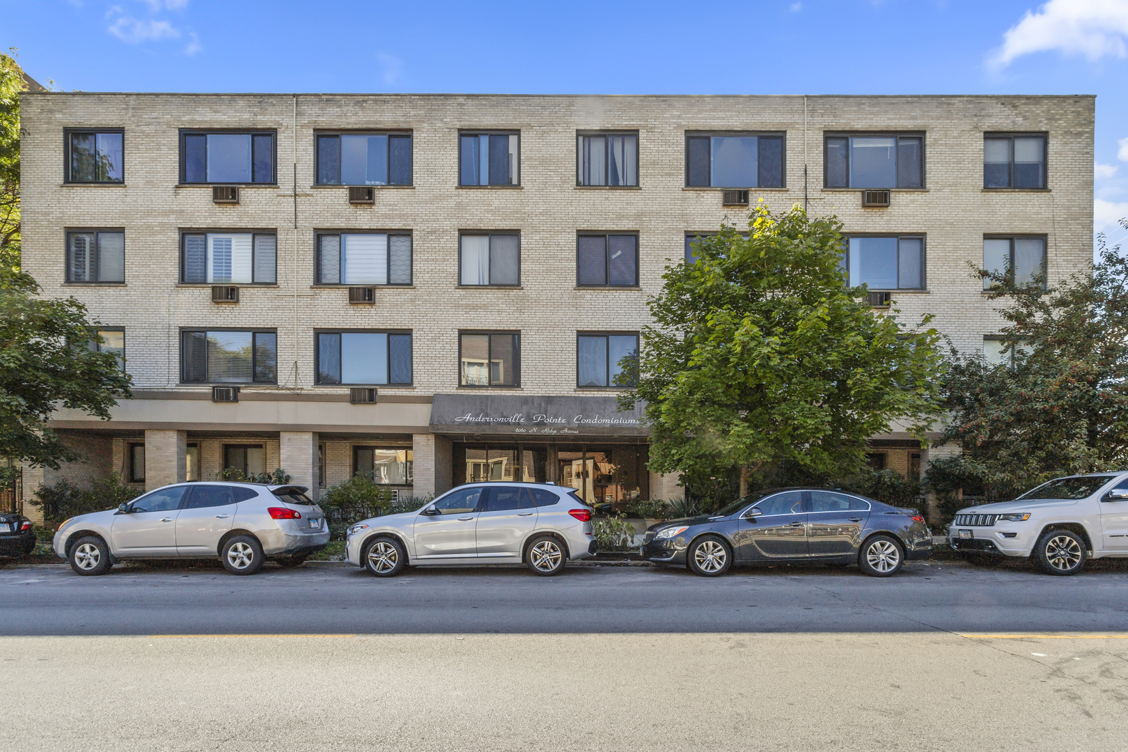 a view of a cars parked in front of a building