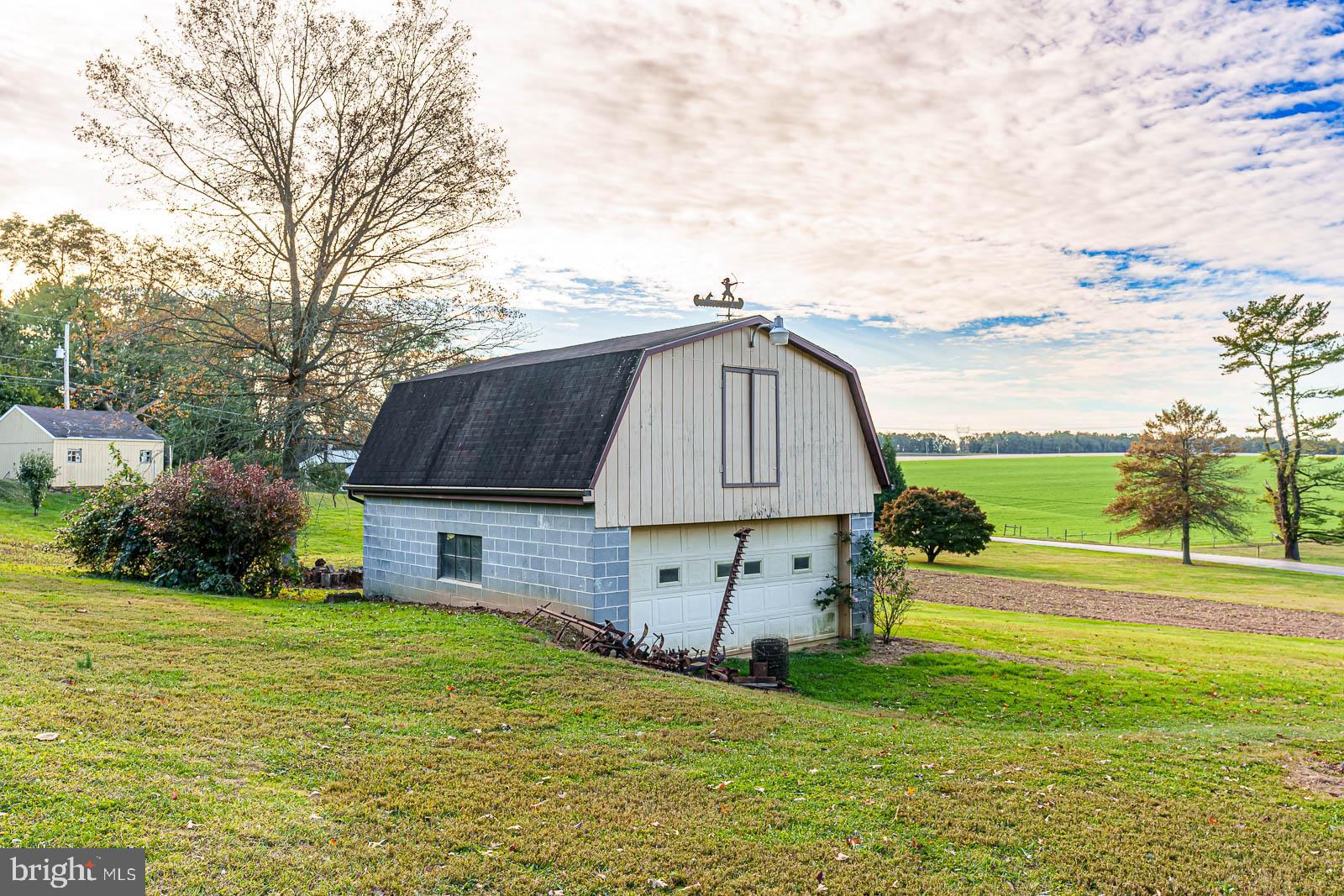 a front view of house with yard and outdoor seating