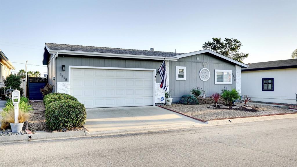 a front view of a house with garage