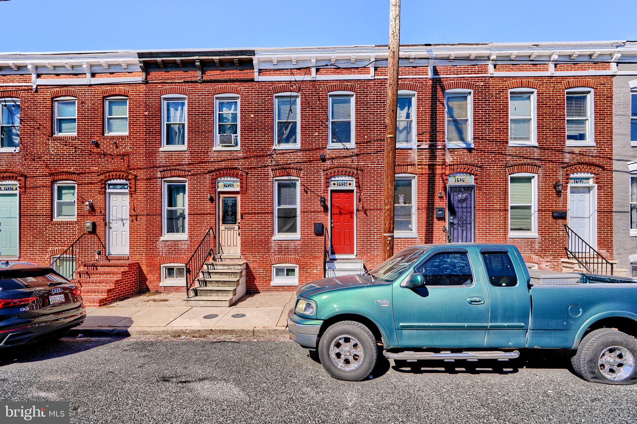 front view of a house with car parked