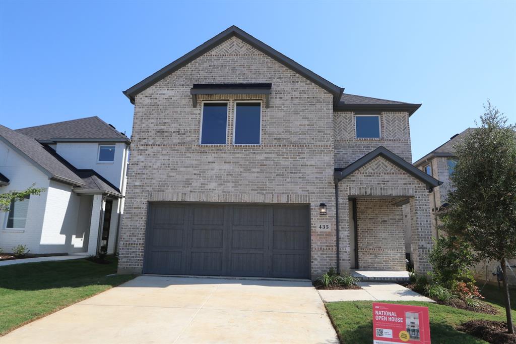 a front view of a house with garage