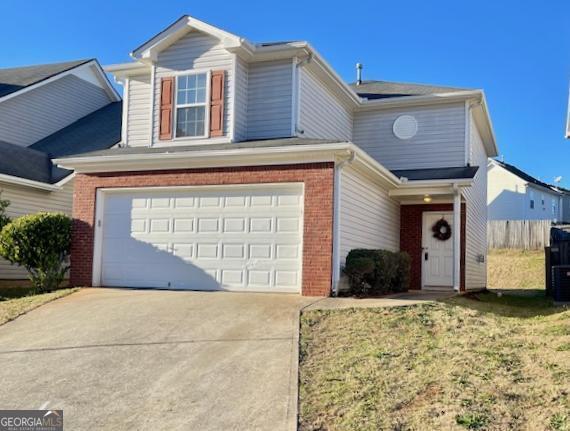 a front view of a house with a yard