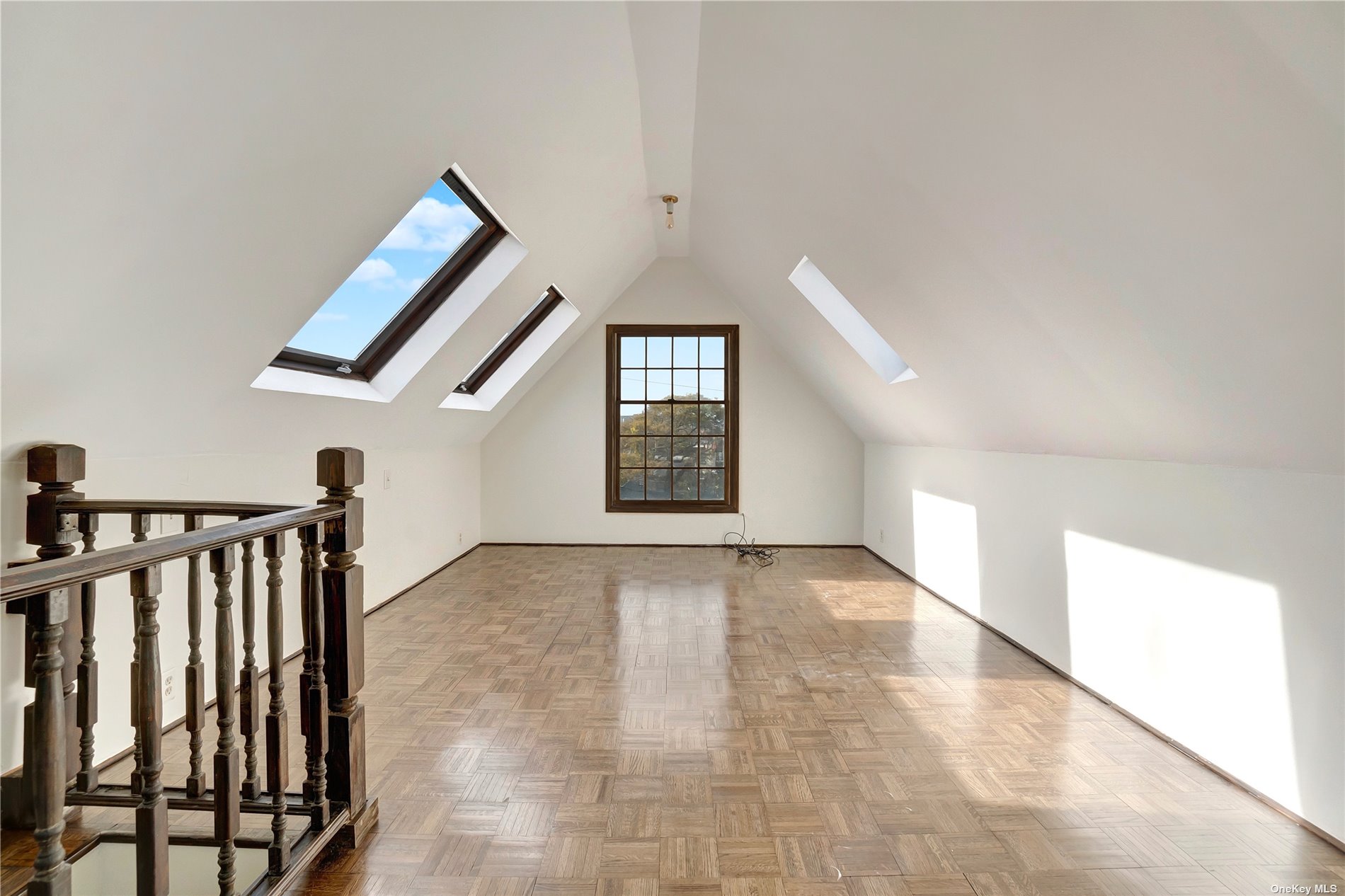 a view of an empty room with windows