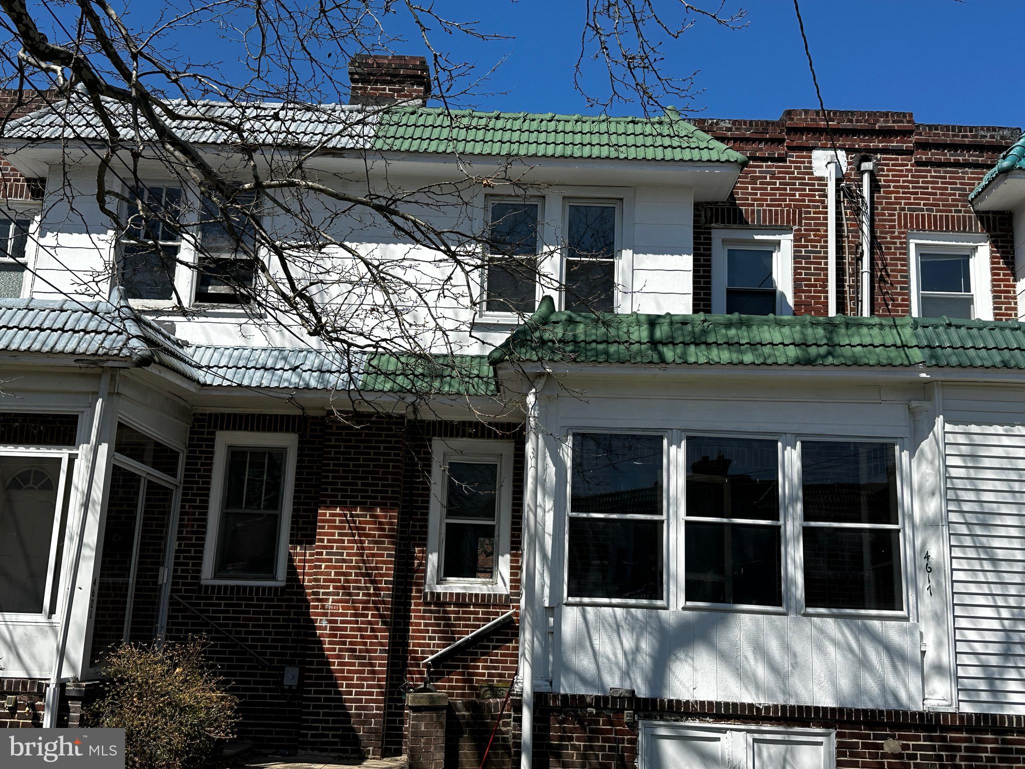 a front view of a house with glass windows