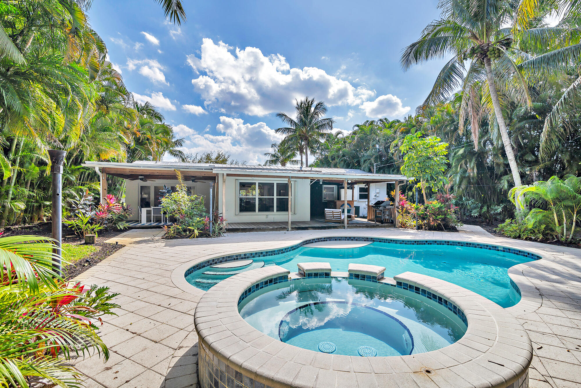 a view of swimming pool with seating space