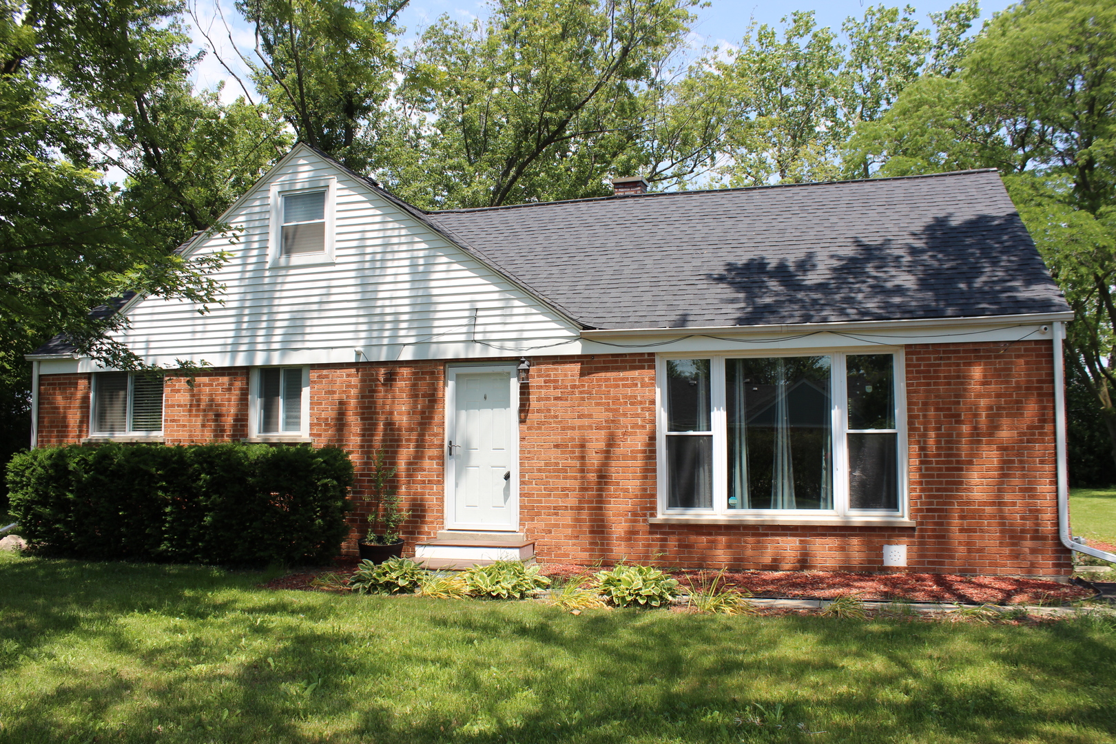 front view of a house with a yard