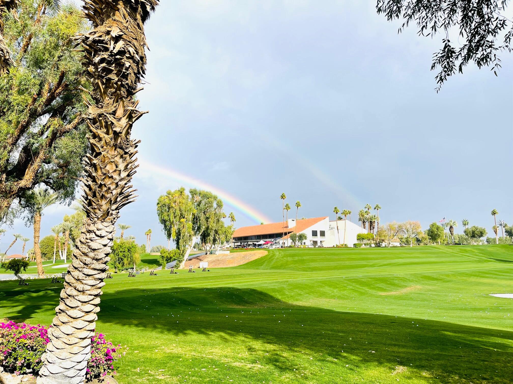 a view of a golf course with a lake